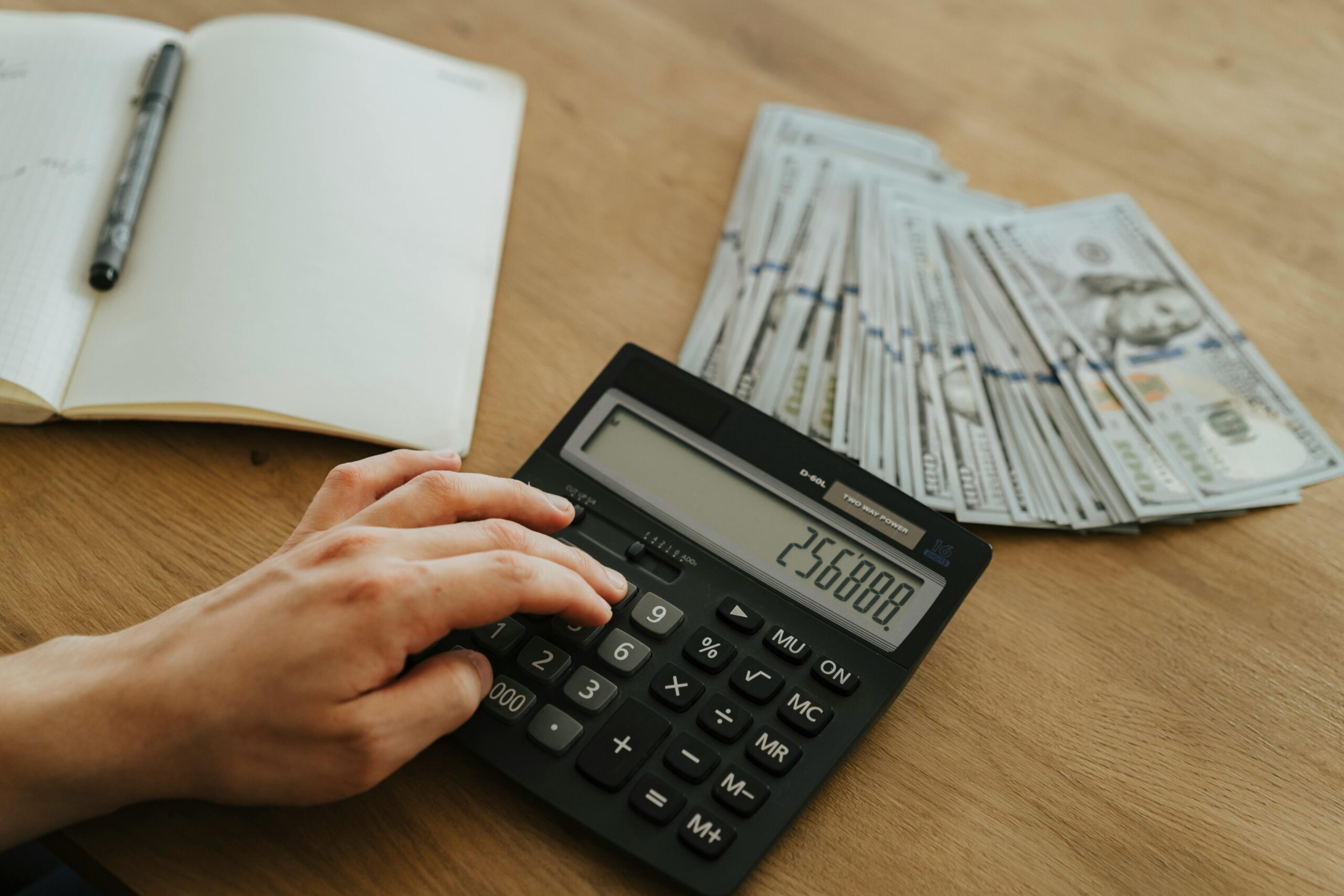 Photo by olia danilevich: https://www.pexels.com/photo/a-person-holding-black-desk-calculator-5466806/